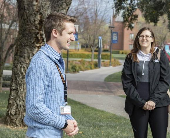 Staff member leads a campus tour